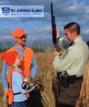 Ranger speaking to father and daughter about hunting safety