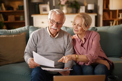 Elderly couple reviewing estate plan documents