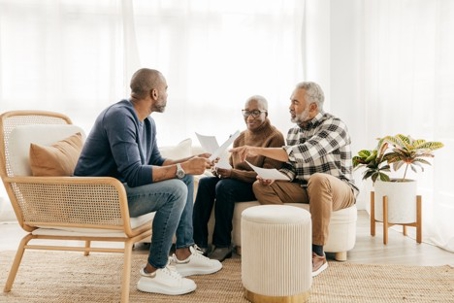 Senior couple and estate planning paperwork with son chosen as executor