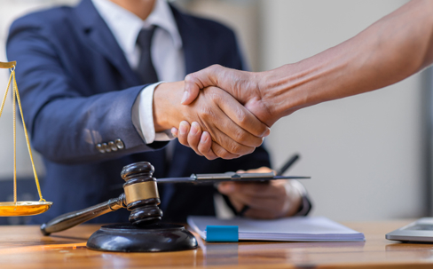 Lawyer shaking hands with a client