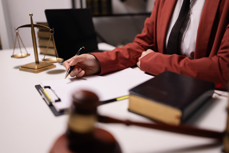Lawyer reviewing documents on his desk