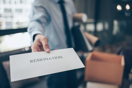 Businessman showing resignation letter