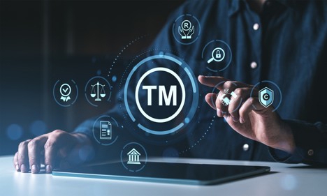 Man interacting with trademark protection icons on a digital interface